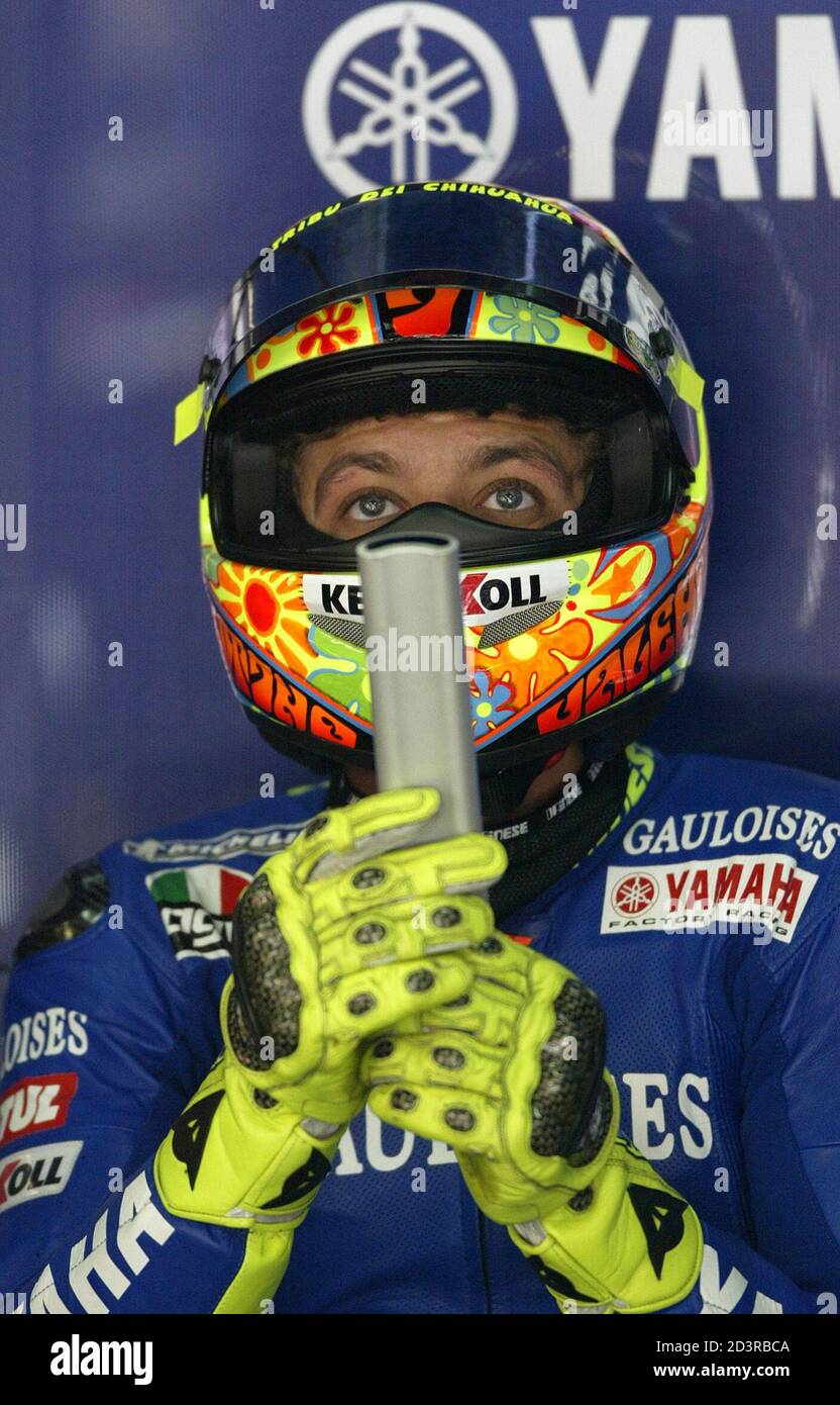 ITALIAN RIDER ROSSI PLAYS WITH A REMOTE CONTROL DURING MOTO GP TEST  PRACTICE AT MONTMELO RACETRACK IN BARCELONA. Italian rider Valentino Rossi  plays with a remote control inside his box during Moto