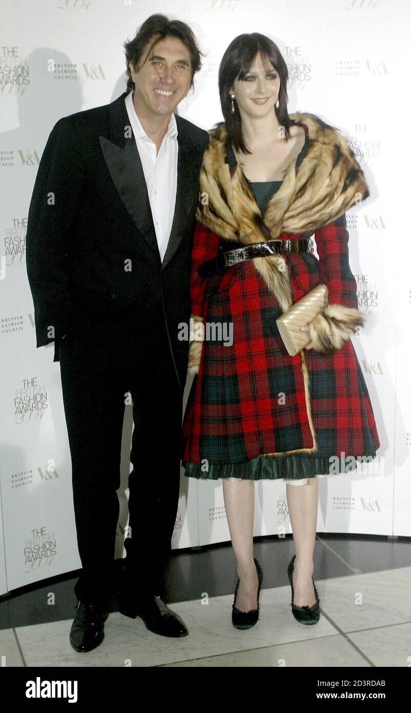 British Singer Bryan Ferry L And Girlfriend Katie Turner Arrive At The 2004 British Fashion Awards
