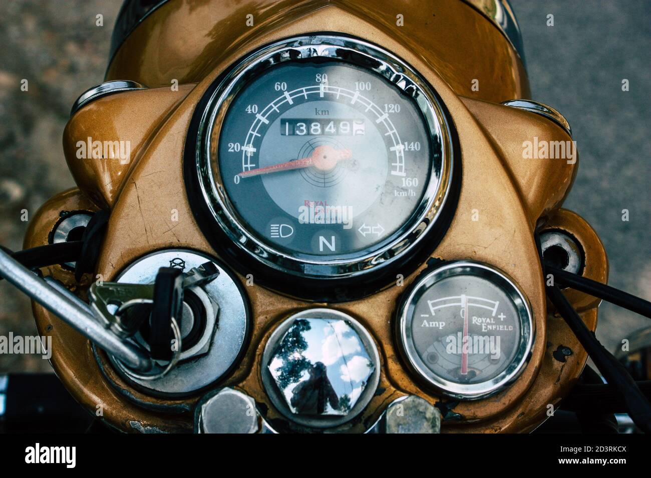 Closeup of a motorcycle rolling in the streets of the city center of