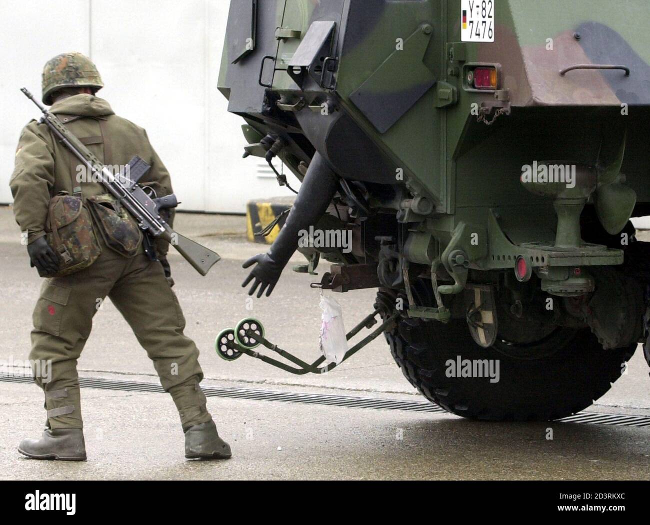 A German Soldier Marks The Area Around A Fuchs Tank As A Contaminated Area During A Media Presentation In Sonthofen November 19 2001 Germany Is Offering 800 Soldiers Of Its Fuchs Units