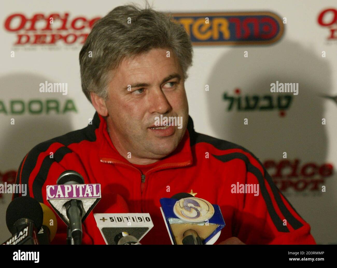 AC Milan coach Carlo Ancelotti talks to journalists during a press  conference in Nicosia March 13, 2002. AC Milan play Hapoel Tel Aviv here in  a UEFA Cup quarter final first leg