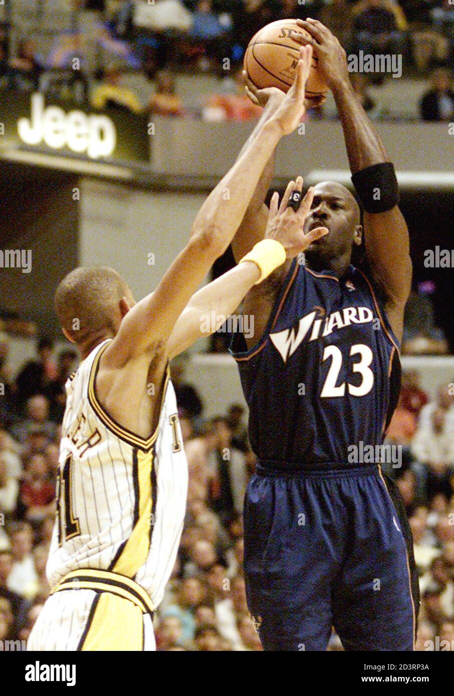 Washington Wizards guard Michael Jordan (23) shoots a jump shot over  Indiana Pacers guard Reggie Miller November 29, 2002 at Conseco Fieldhouse  in Indianapolis. Jordan announced November 28 that this will be