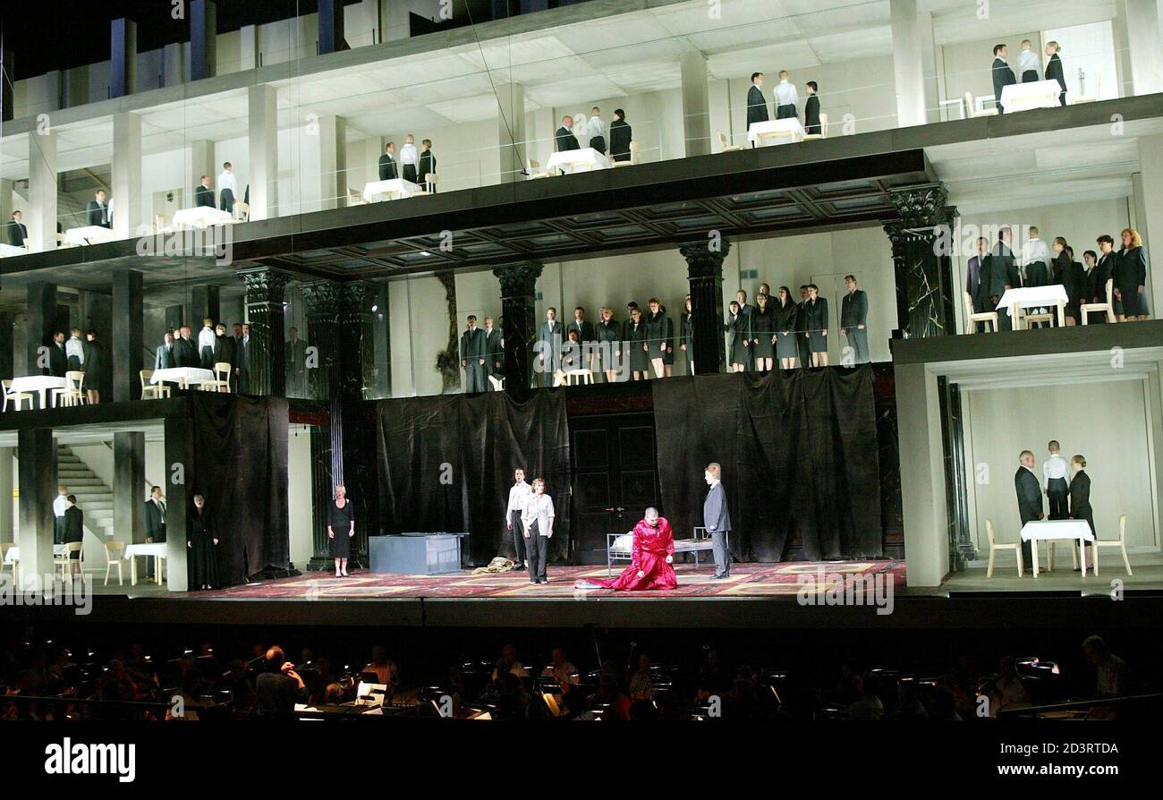 Swiss born tenor Michael Schade as Tito Vespasiano (red dress), Elina Garanca from Lithuania as Annio (R), Dorothea Roeschmann from Germany as Vitellia, Barbara Bonney from the United States as Servilia, Luca Pisaroni from Italy as Publio and Vesselina Kasarova from Bulgaria as Sesto (LtoR on centre stage) perform during a dress rehearsal of Wolfgang Amadeus Mozart's opera 'La Clemenza di Tito'. The world famous cultural Salzburg Festival (Salzburger Festspiele) lasts from Friday July 25 to Sunday August 31 and the opera has its premiere August 6, 2003. Picture taken at the Salzburg Festival A Stock Photo