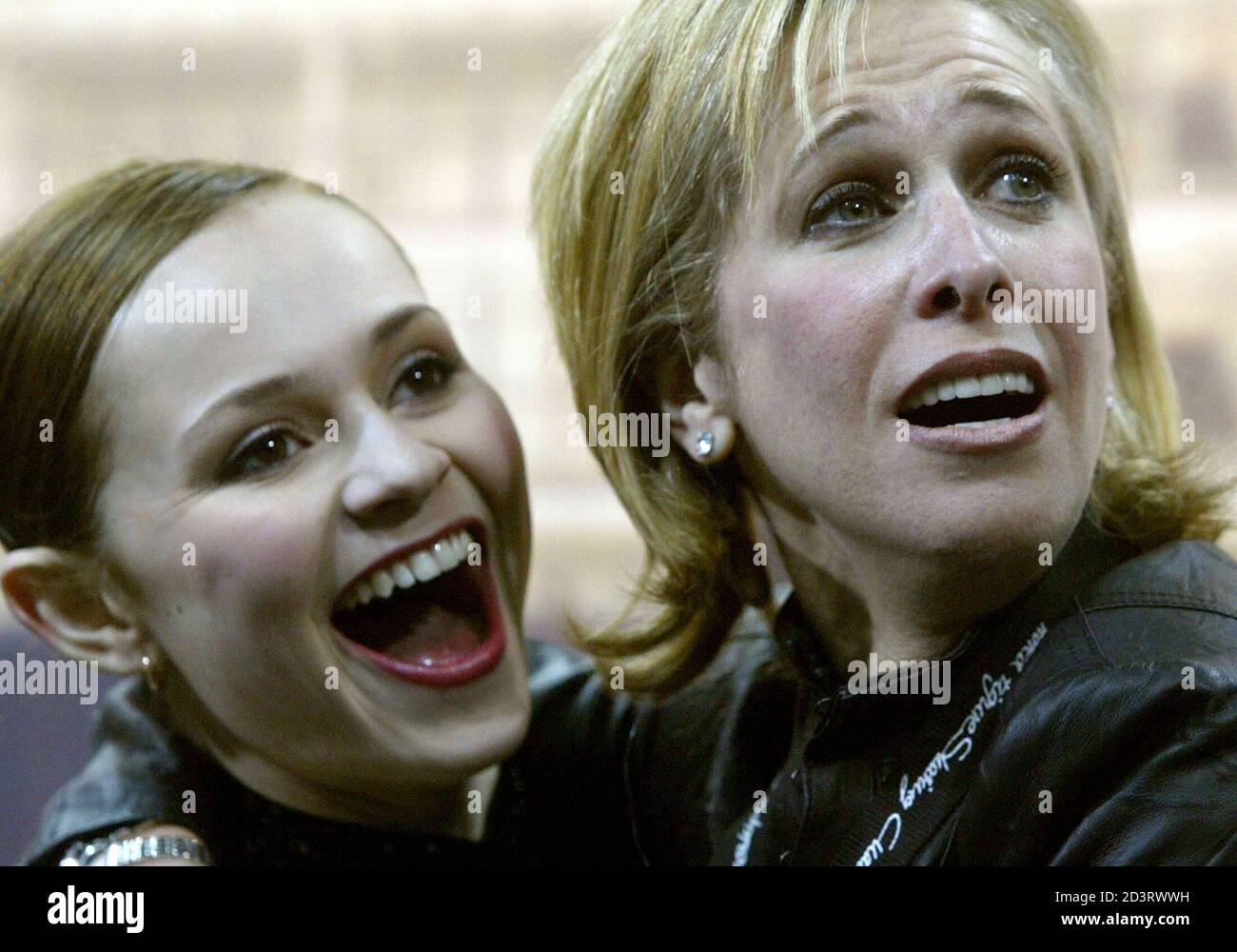 COHEN FROM . AND COACH WAGNER REACT TO HER HIGH MARKS AT WORLD FIGURE  SKATING CHAMPIONSHIPS IN DORTMUND. Sasha Cohen from the . and her coach  Robin Wagner (R) react to her