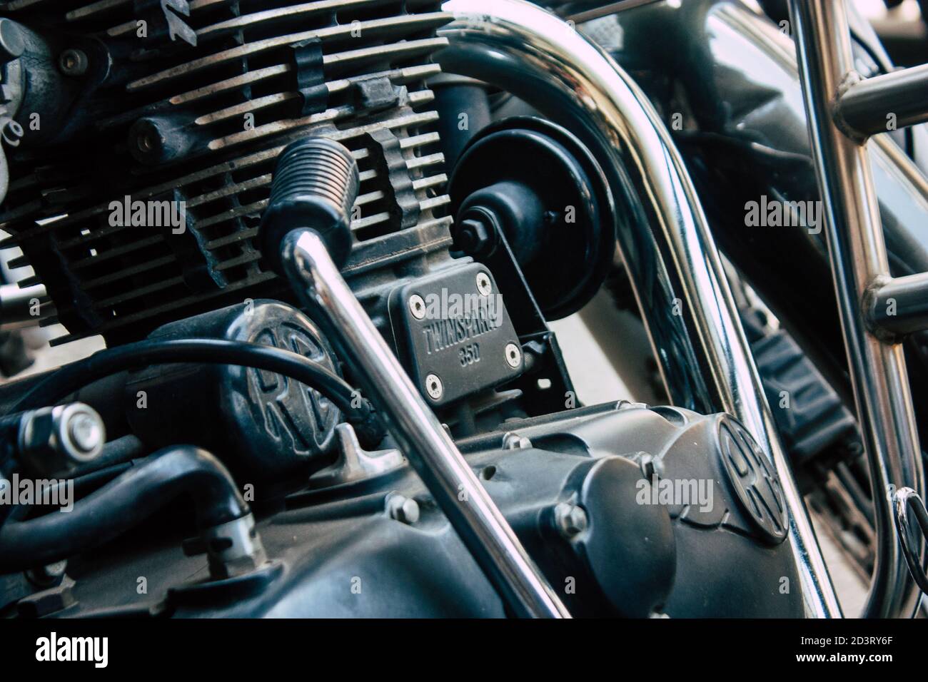 Closeup of a motorcycle rolling in the streets of the city center of