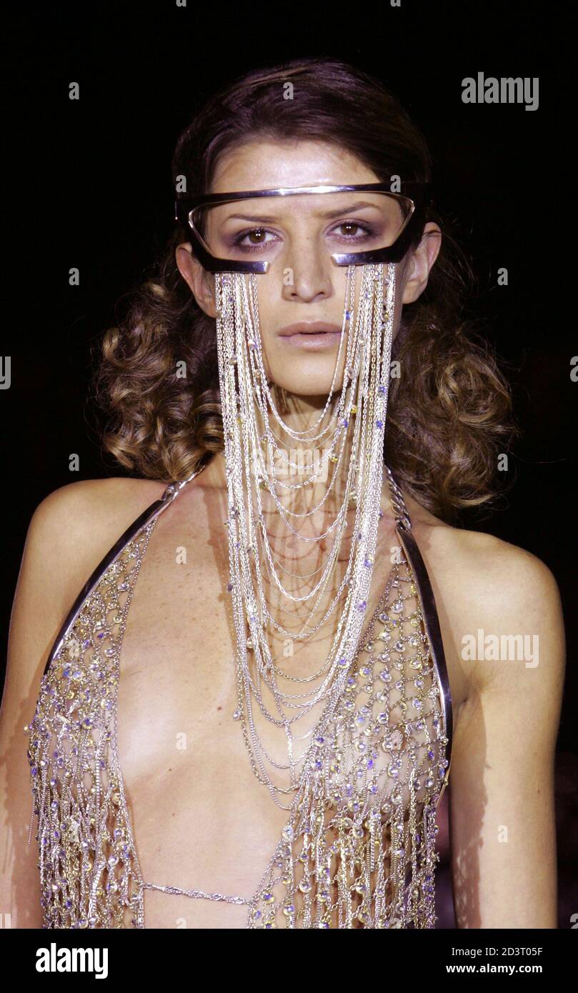 A model wears an outfit encrusted with Swarovski crystals during a couture  jewellery fashion show at the Victoria and Albert Museum, London, November  26, 2004. REUTERS/Toby Melville TM/JD/SM Stock Photo - Alamy
