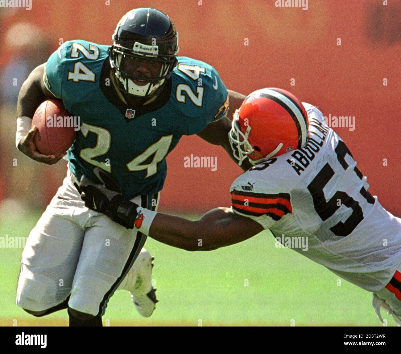 Jacksonville Jaguars running back Chris Howard (L) tries to pull out of a  tackle by Cleveland Browns linebacker Rahim Abdullah (R) during the fourth  quarter at Cleveland Browns Staduim in Cleveland September