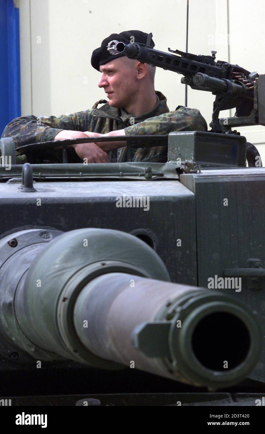 German Kfor Soldier Sit On Top Of A Tank After Arriving In Tetova From Kosovo To Tetovo March 17 2001 Macedonian Troops Shelled Guerrilla Positions In The Mountains Of Northwest Macedonia On