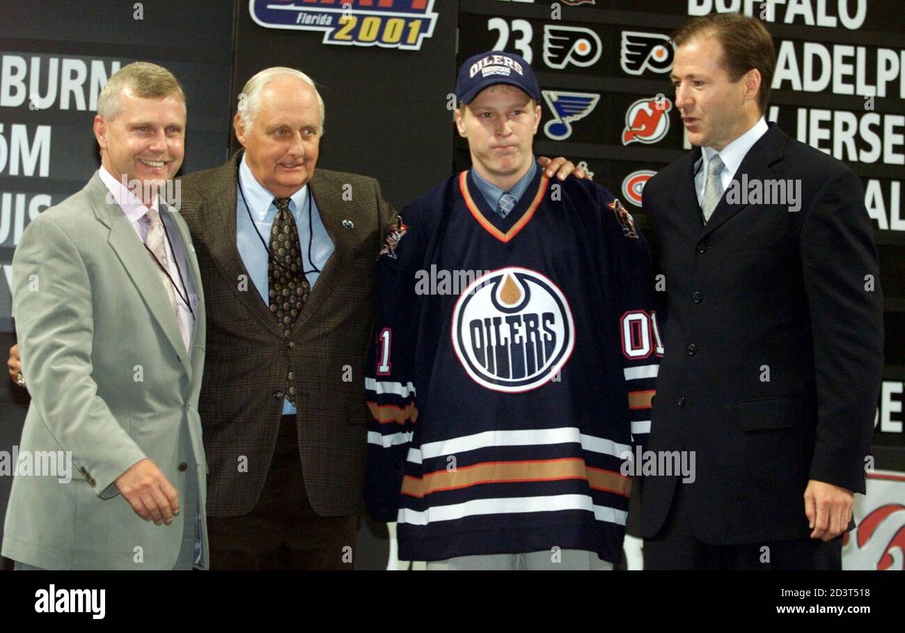 Ales Hemsky of Pardubice, Czech Republic, poses with executives of the  Edmonton Oilers wearing his new jersey after the team chose him as the  thirteenth pick in the first round of the