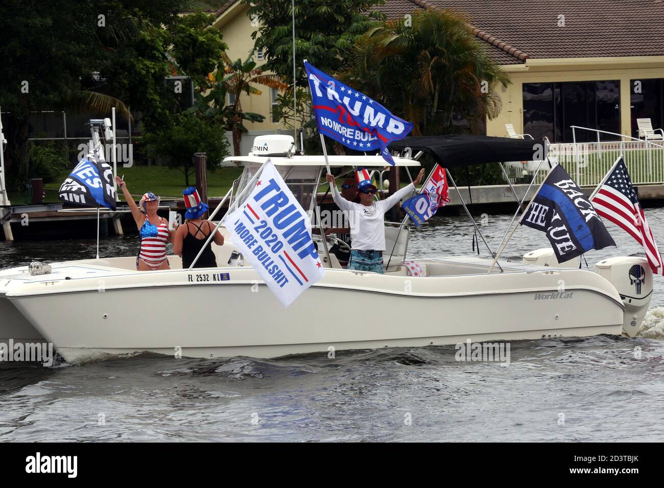 Donald Trump fans were out in their boats in droves during torrential rain to show their support during today's Trump 2020 Flotilla along the Intracoastal Waterways that began at Fort Lauderdale Sunrise Bay and ended at Boca Lake in Boca Raton with some sunshine.  The Avid supporters from 'Boaters For Trump South Florida' proudly Promoted the COVID stricken President for his 2020 Re-election during today's Trump 2020 Flotilla.  Jim Norton (US House of Rep), Catherine McBreen (Supervisor Board of Elections), Brian Norton (State Senator)and Carla Spalding (running against Debbie Wasserman-Schult Stock Photo