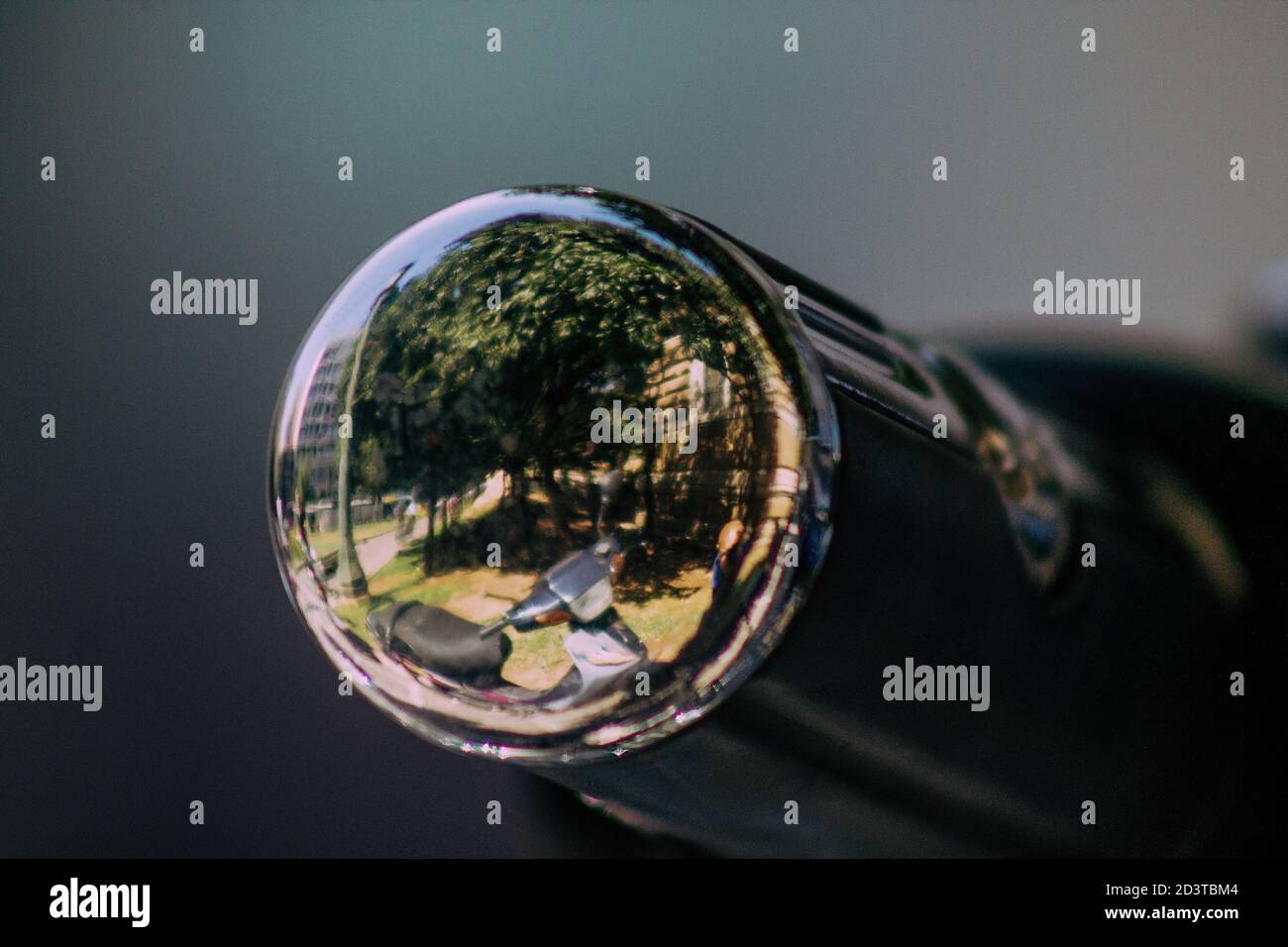 Closeup of a motorcycle rolling in the streets of the city center of