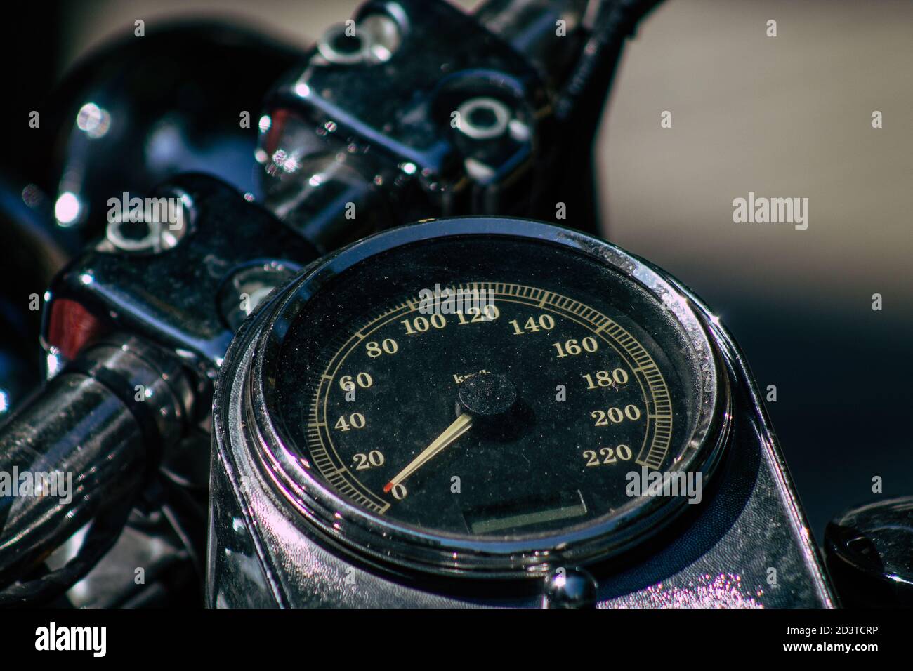 Closeup of a motorcycle rolling in the streets of the city center of
