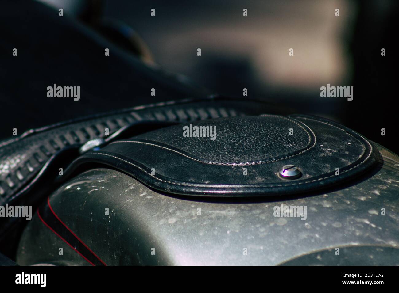 Closeup of a motorcycle rolling in the streets of the city center of