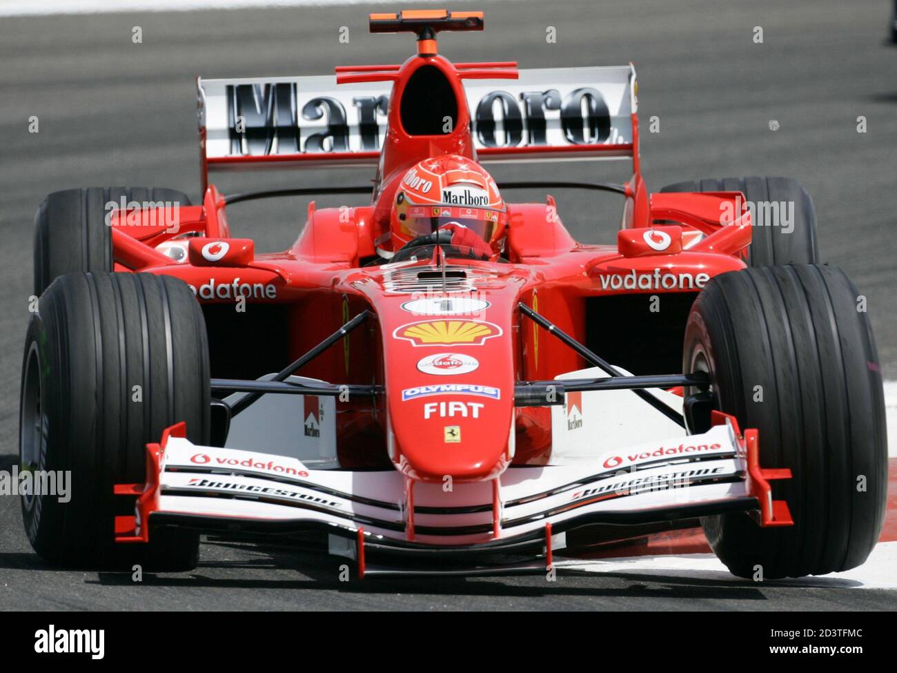 Ferrari Formula One world champion Michael Schumacher of Germany takes a  corner in the new F2005 model during the first practice session before the  Bahrain Formula One Grand Prix in Bahrain April