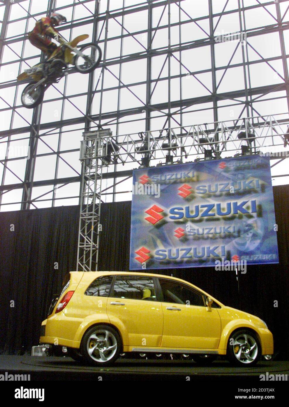 sports hatchback cars on Motorcycle Racer Travis Pastrana Upper Left Jumps Over The Suzuki Sx Concept Vehicle At The Car S Unveiling At The New York International Auto Show On April 11 2001 The Car S Name Sx