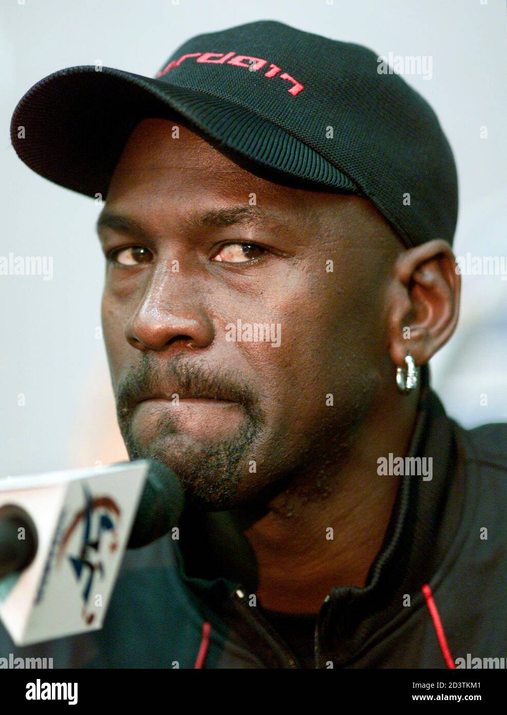 Basketball great Michael Jordan listens 