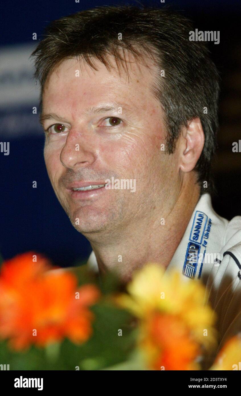 Steve Waugh, former captain of the Australian cricket team, smiles at the launch of insurance services during a news conference in Bombay May 31, 2004. Waugh, who retired in January as the world's most-capped test player, is the brand ambassador for an insurance company. REUTERS/Punit Paranjpe  PP/FA Stock Photo