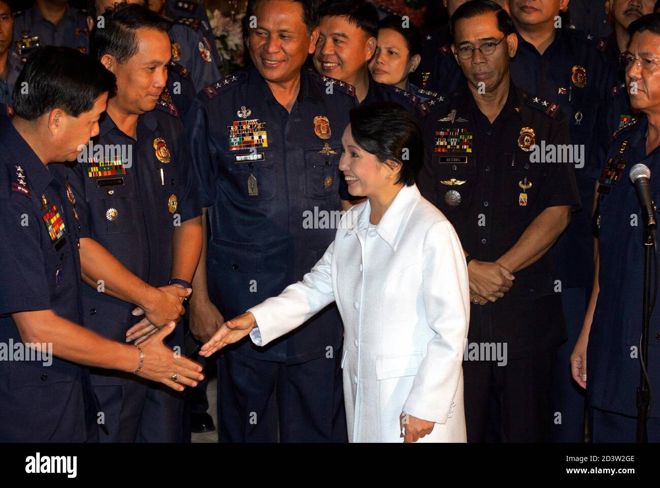 President Gloria Macapagal Arroyo Greets High Ranking Philippine Police Officers After They Have Pledged Their Support To The President At The Presidential Palace In Manila July 7 2005 Philippines Vice President Noli De