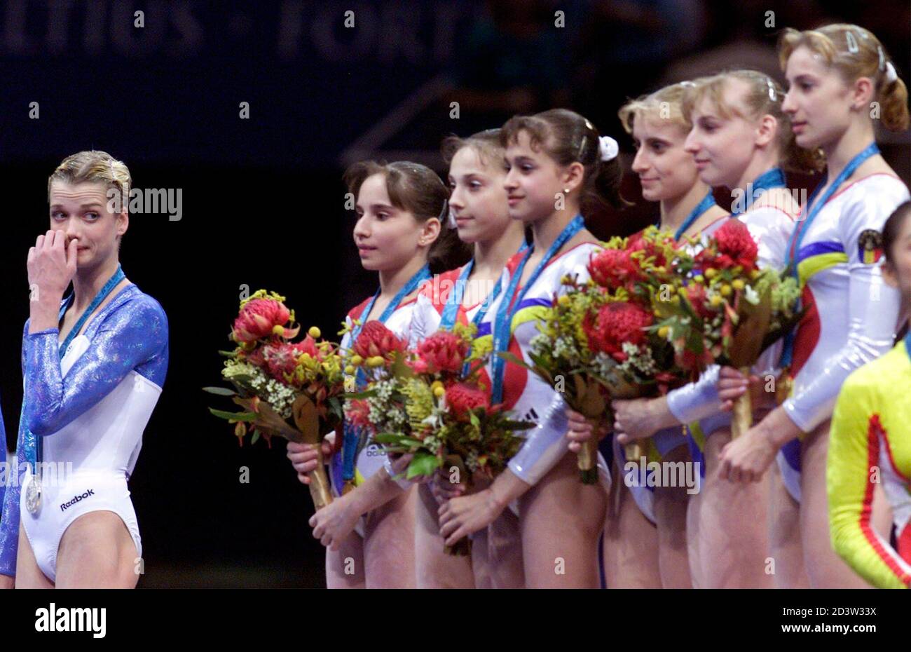 Russian gymnast Svetlana Khorkina (L) looks at the winning Romanian