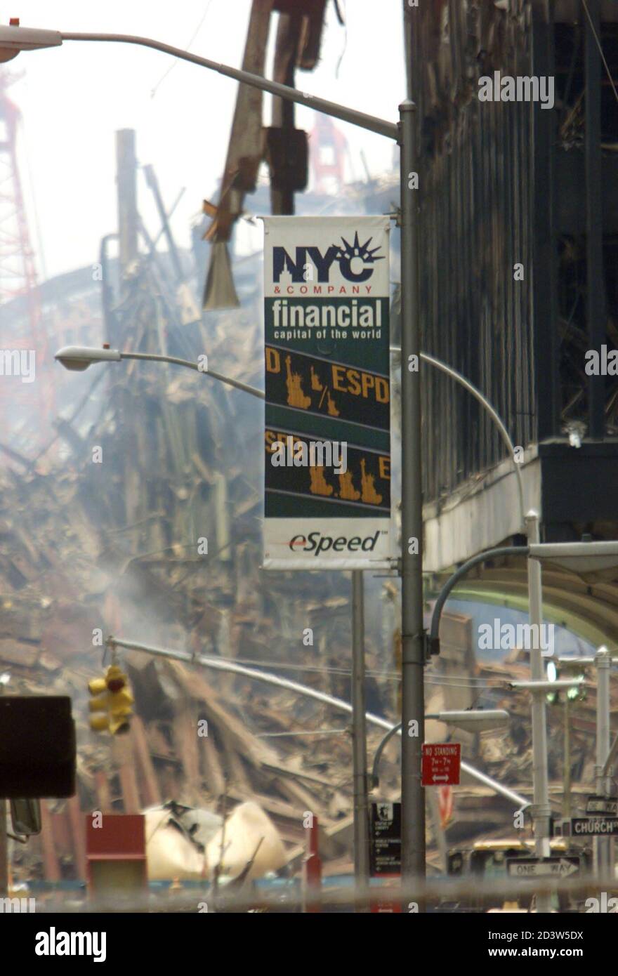 A financial district banner still hangs near the site of the World Trade Center attack, September 20, 2001. President Bush gives an address to a joint session of Congress tonight to urge Americans to be vigilant and patient as the United States prepares to strike the first blow in a war on terrorism. REUTERS/Kai Pfaffenbach  MS/ME Stock Photo