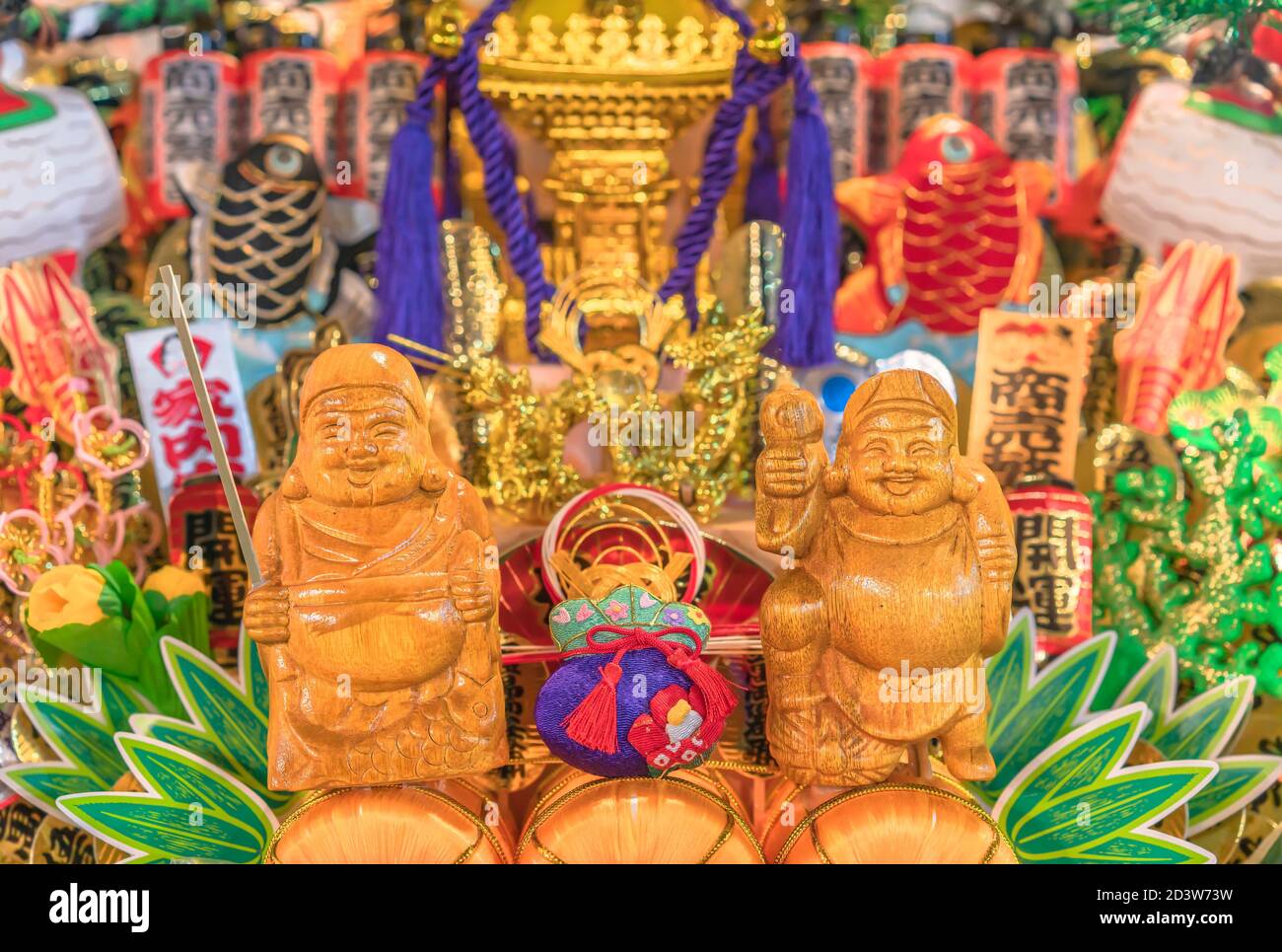 asakusa, japan - november 08 2019: Close-up on an auspicious rake ornated with lucky charms and deities of Japanese folklore like Ebisu god of fishing Stock Photo