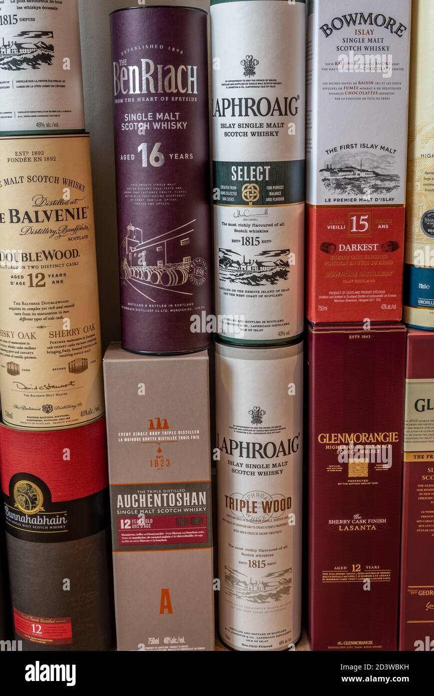 Miscellaneous scotch whisky presentation boxes stacked together to create a background. Stock Photo