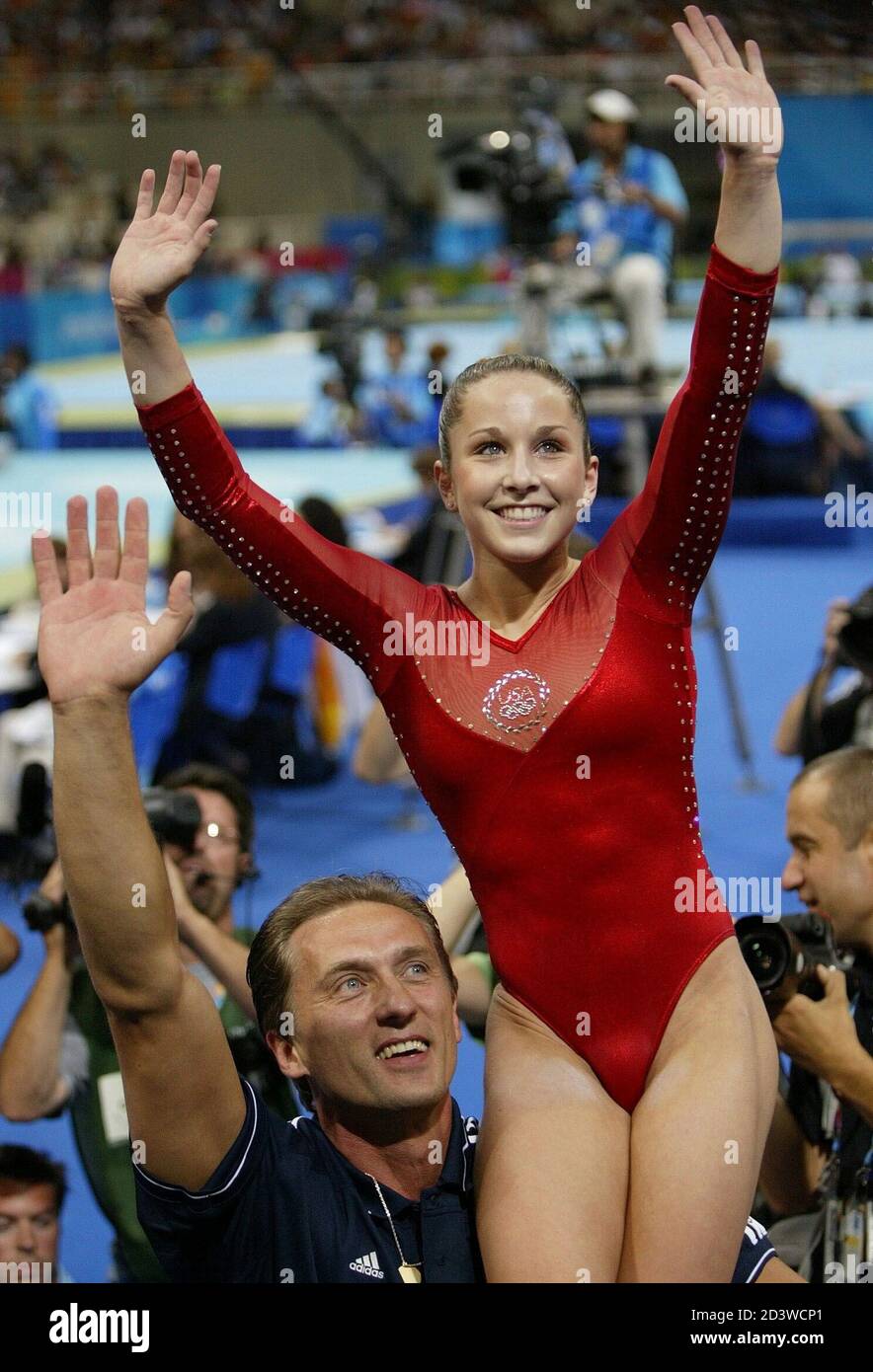 Carly Patterson Of The U S Is Carried On The Shoulder Of Coach Yevgeny Marchenko After She Clinched The Gold Medal In The Women S Artistic Gymnastics Individual All Round Final At The Athens 04