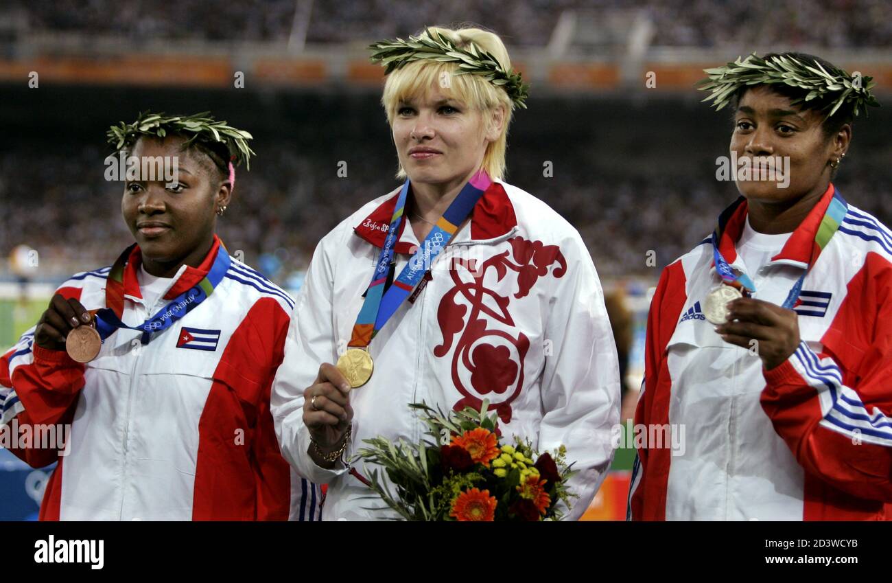 Medal winners in the women's hammer throw pose at the awards ceremony at the 2004 Olympic Summer