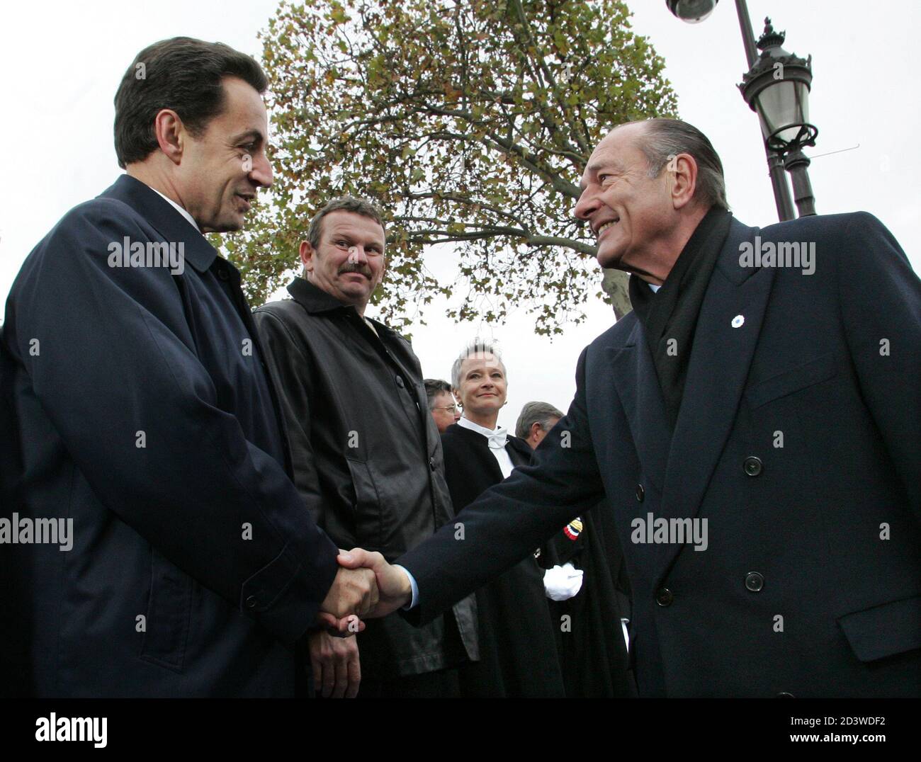 French President Jacques Chirac (R) and Finance Minister Nicholas Sarkozy (L) meet during armistice day ceremonies in Paris, November 11, 2004. Sarkozy is widely expected to challenge Chirac for the presidency in the next French elections. REUTERS/Patrick Kovarik/Pool  MLM/nf/ws Stock Photo