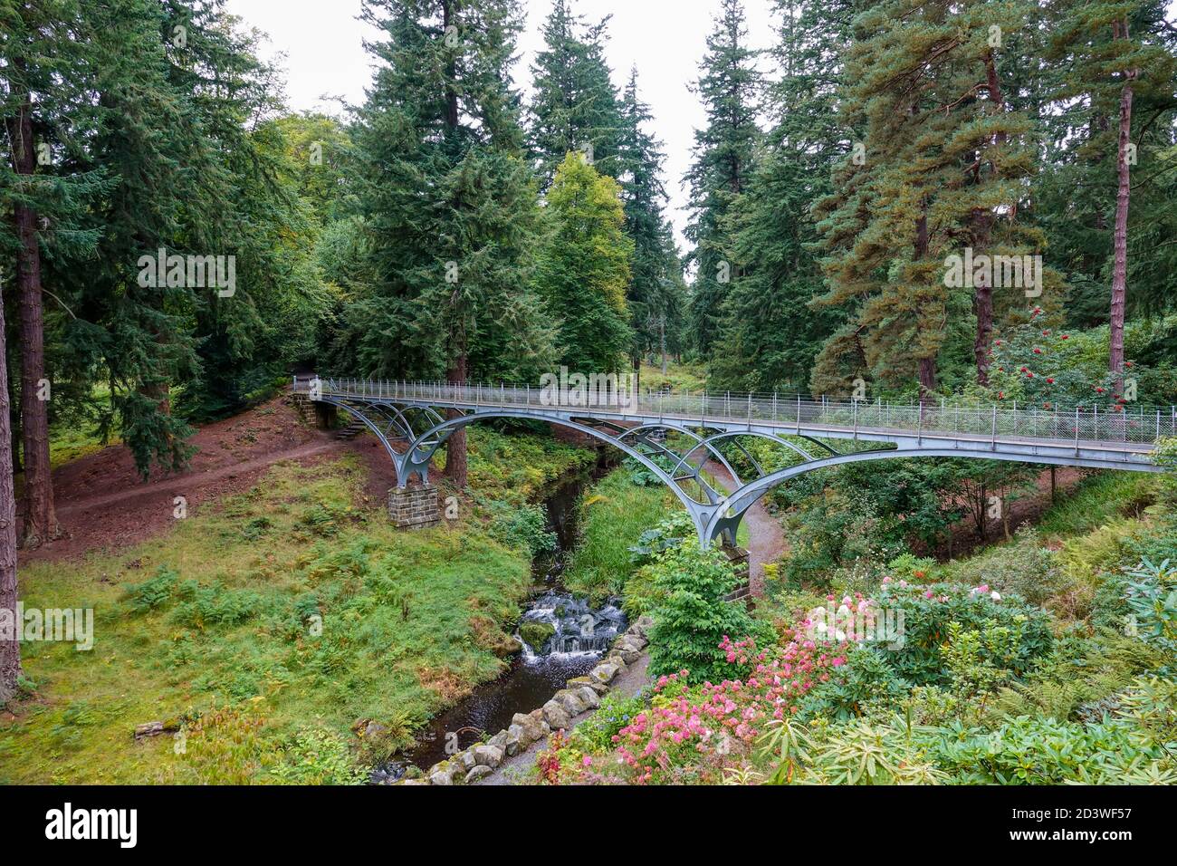 Steel bridge across the river at Cragside house Stock Photo Alamy