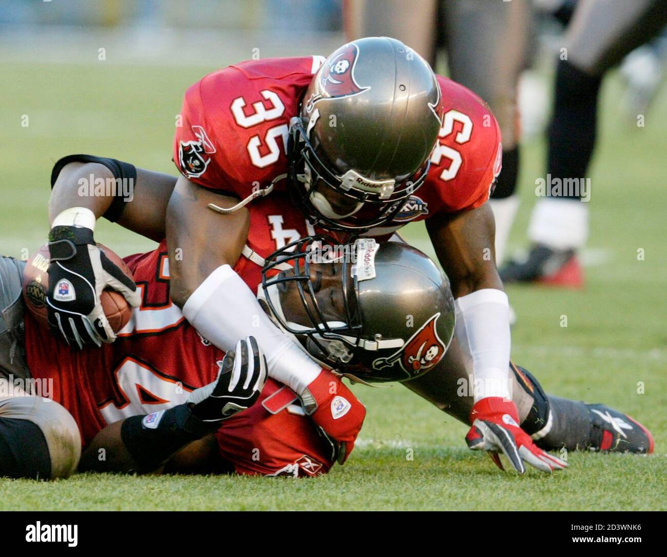 Tampa Bay Buccaneers' cornerback Corey Ivy (35) celebrates the second  interception of the game by teammate safety Dexter Jackson (on ground), in  the first half of Super Bowl XXXVII, in San Diego