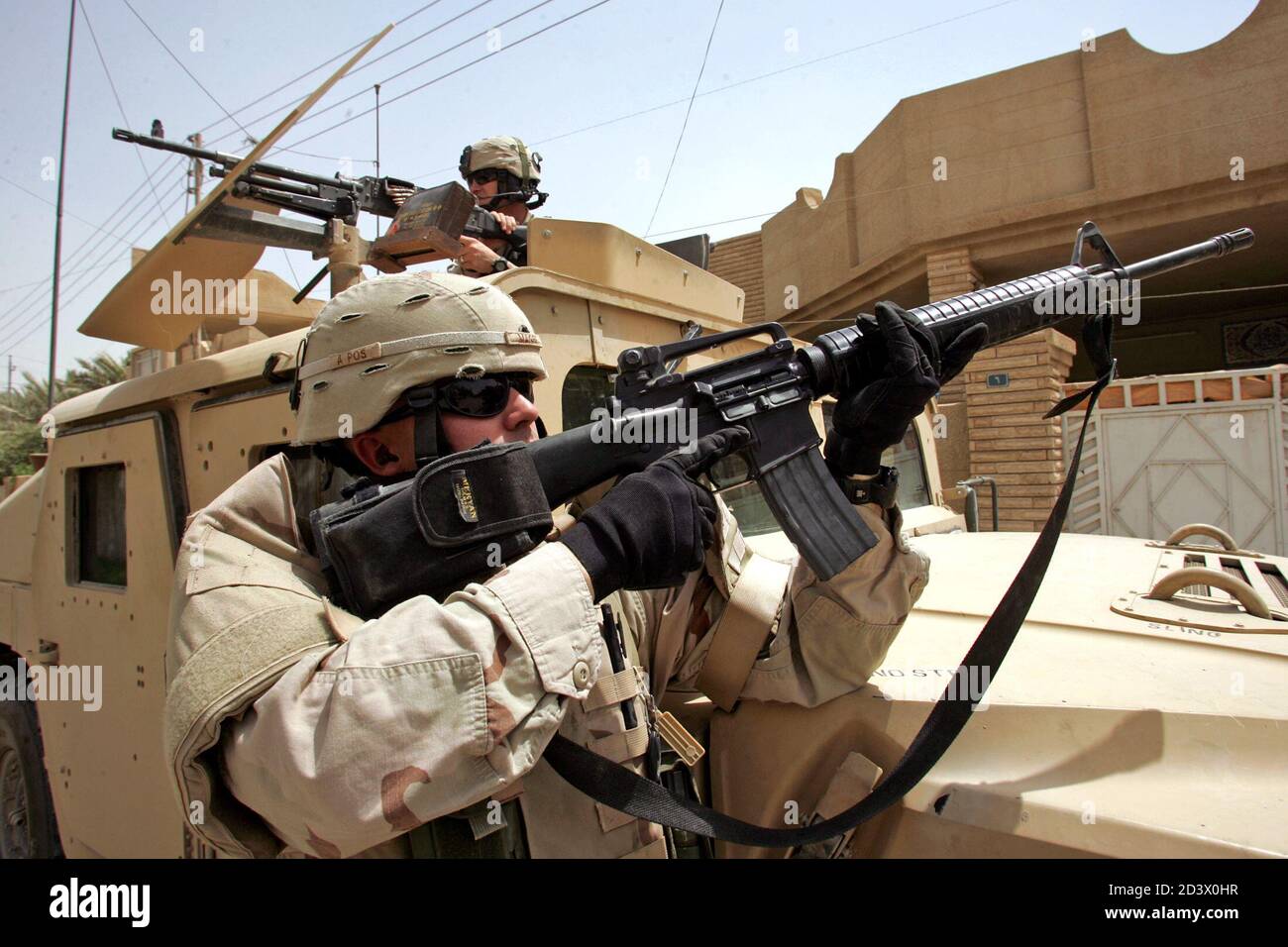 U.S. soldiers from the 3rd Infantry Division take up positions during a ...