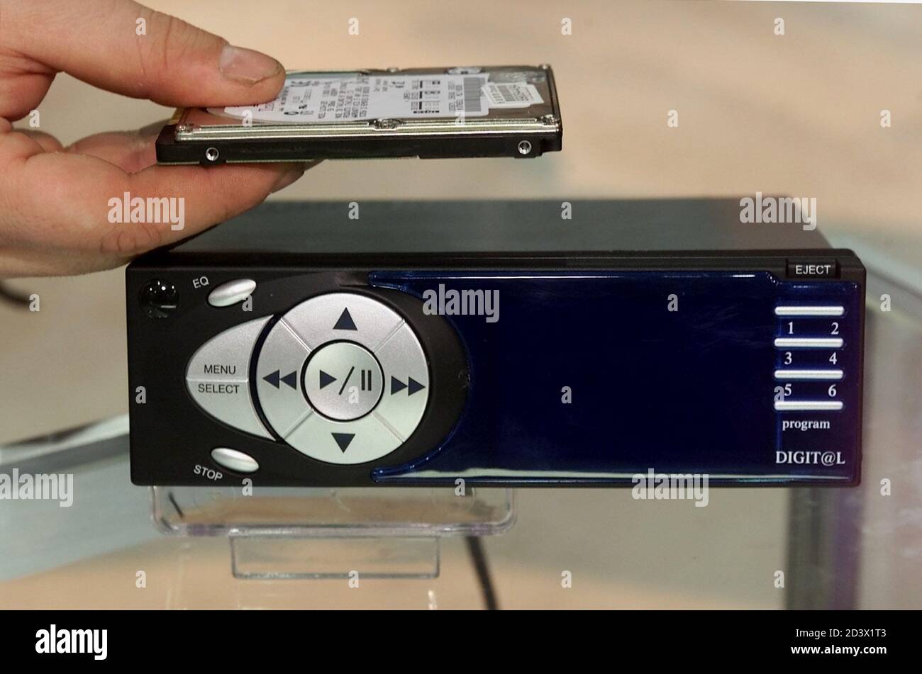 Jimmy Buchheim President Of The New Jersy Office Of Ssi America Holds A 20 Gigabyte Removeable Hard Drive That Is Contained In The In Dash Car Jukebox During The Consumer Electronics Show January