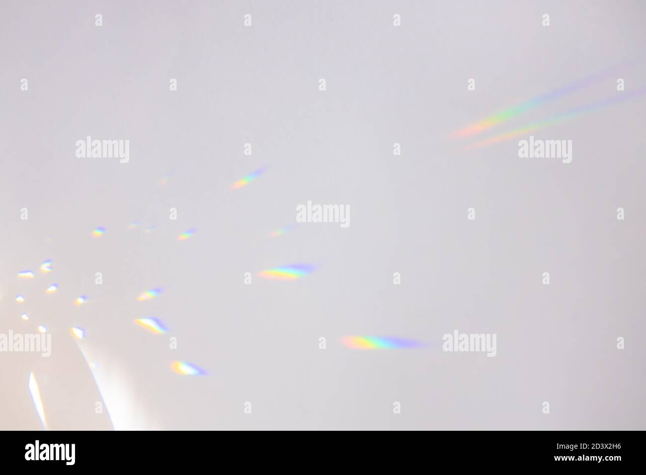 Bright iridescent highlights on a neutral gray background. Stock Photo