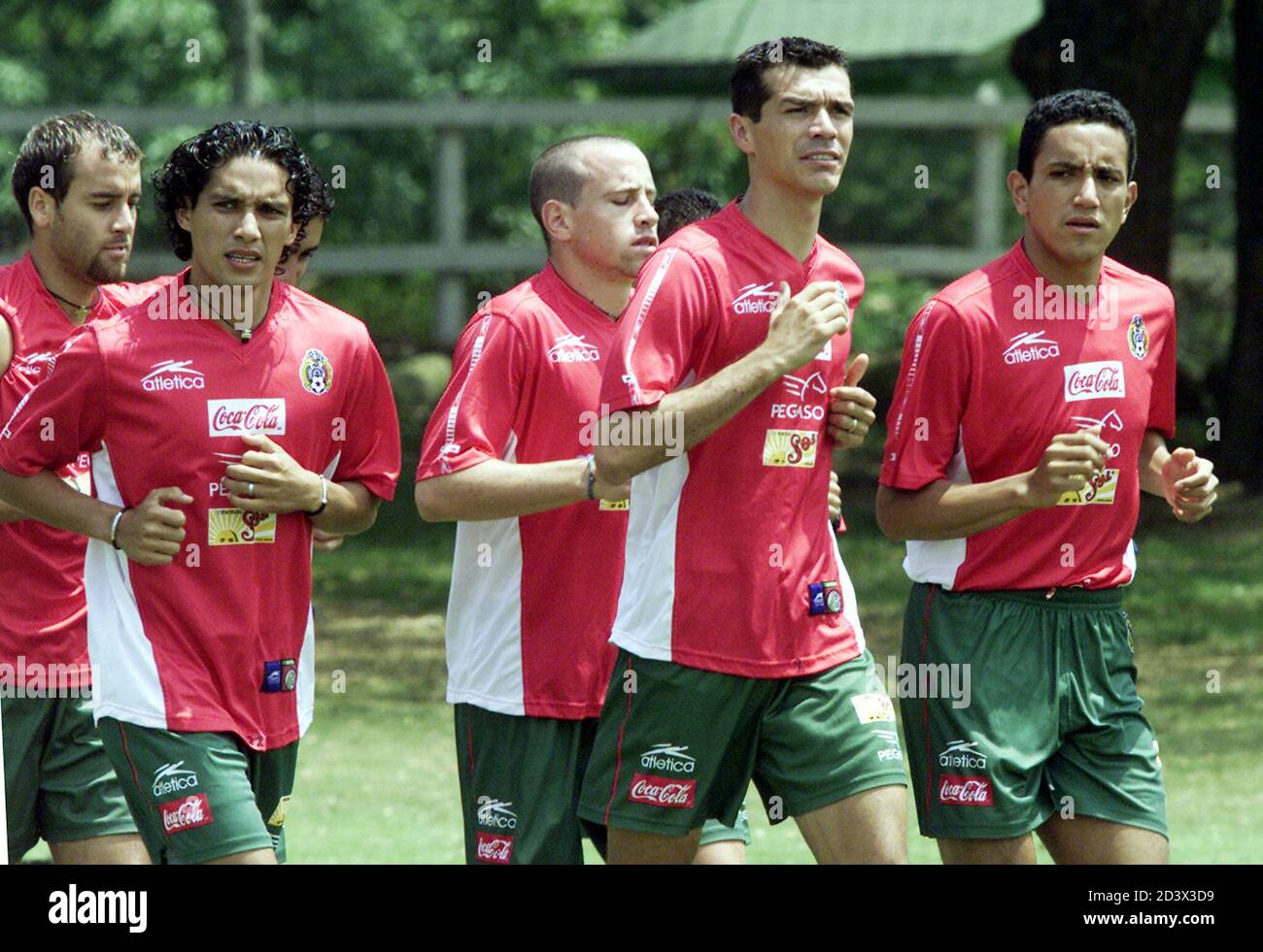 Mexicans (L-R) Johan Rodriguez, Adrian Martinez, Oscar Perez, Jared Borgueti and Ramon Morales jog at the Campestre Club in Cali where the team is staying during the Copa America, July 13, 2001. Mexico upset Brazil in their first match of the tournament and plays Paraguay on July 15. RR Stock Photo