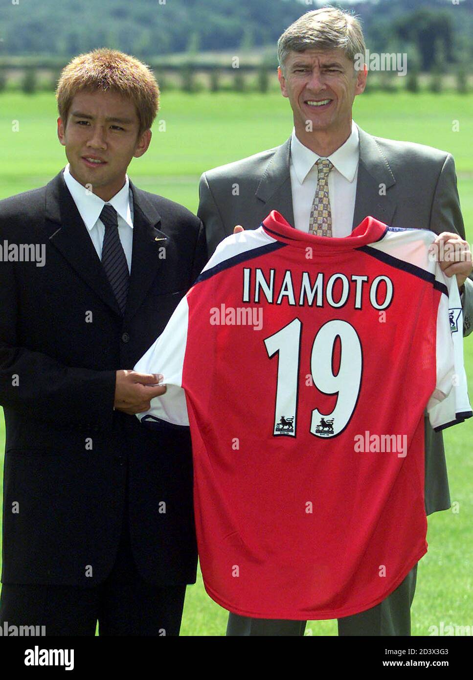 Japanese Soccer Player Junichi Inamoto L Holds His Team Strip With Arsenal Manager Arsene Wenger After Signing For Arsenal Football Club July 23 01 Inamoto 21 Signed With Arsenal As A Midfielder