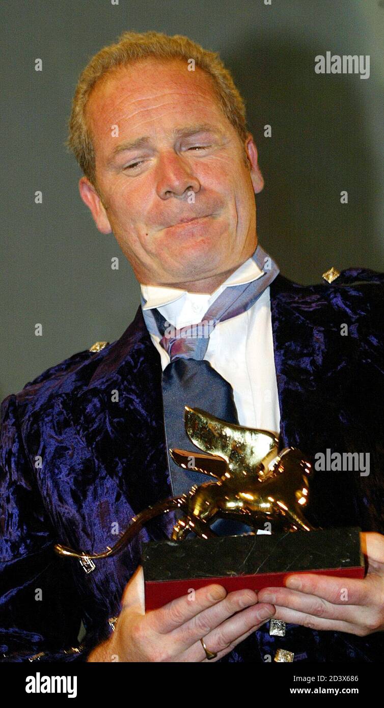 Scottish director Peter Mullan holds his Golden Lion for the best film