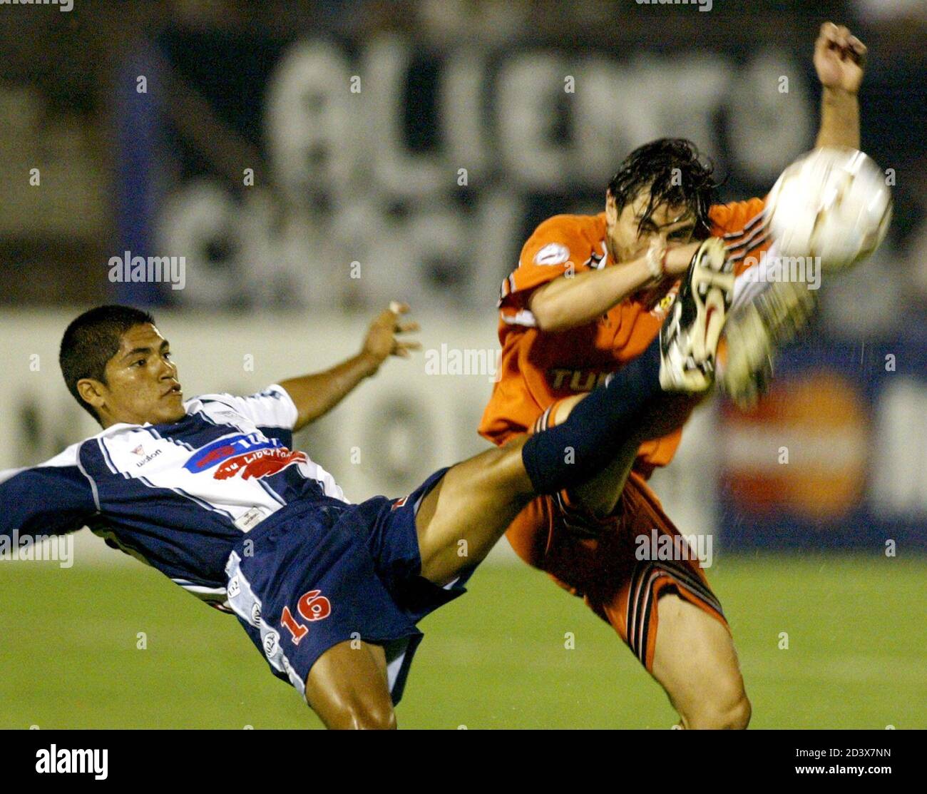 Chilean Jaime Gonzalez (R) from Cobreloa club fights for the ball with  Peruvian Cristian Garcia from Alianza Lima during their soccer match for  Libertadores at Matute stadium in Lima, March 5, 2003.