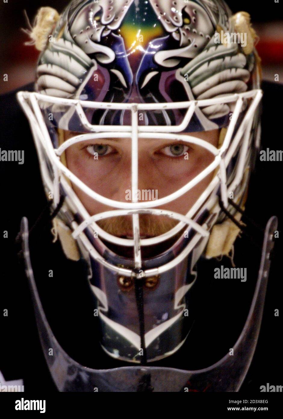 Anaheim Mighty Ducks goalie Jean-Sebastien Giguere looks out from behind his mask during practice at The Pond in Anaheim, California May 21, 2003. The Ducks, who will face the Eastern Conference winner between the New Jersey Devils and the Ottawa Senators, will be playing in their first Stanley Cup in the club's ten-year franchise history. Pictures of the month May 2003 REUTERS/Mike Blake  MB Stock Photo