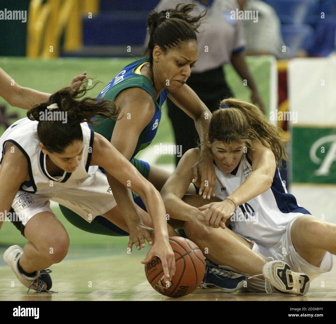 Argentine Players Natalia Rios L And Andrea Gale R Scramble For The Ball With Brazil S Cintia Dos Santos During Their Preliminary Women S Basketball Match At The Xiv Pan American Games In Santo