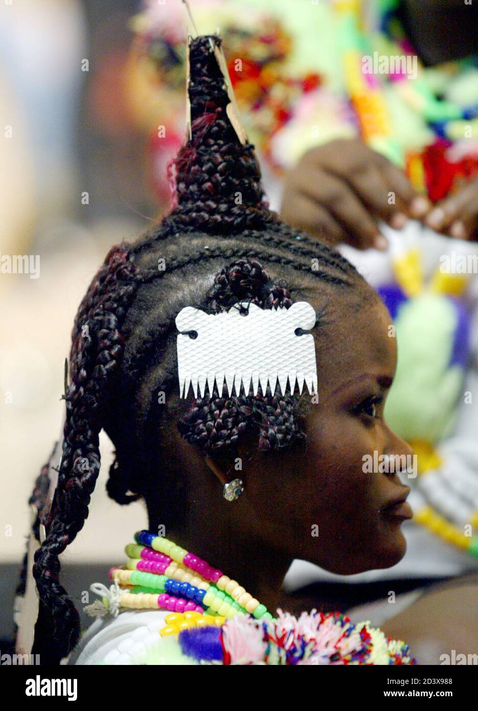 A Nigerian Woman Displays Her Dressed Hair As She Prepares To Perform 