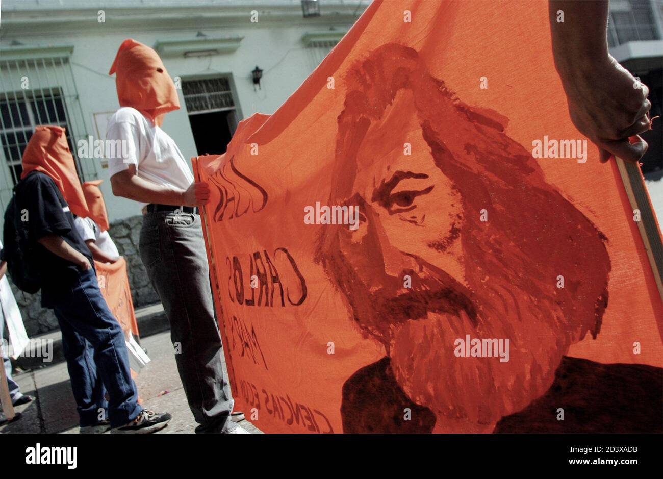 Students from the University of San Carlos carry a painted image of Karl Marx during the annual 'Huelga de los Dolores' parade April 2, 2004 in Guatemala City. The event, a tradition for 106 years, is now used by the students as a chance to air their grievances against the government. REUTERS/Daniel LeClair  DNL Stock Photo