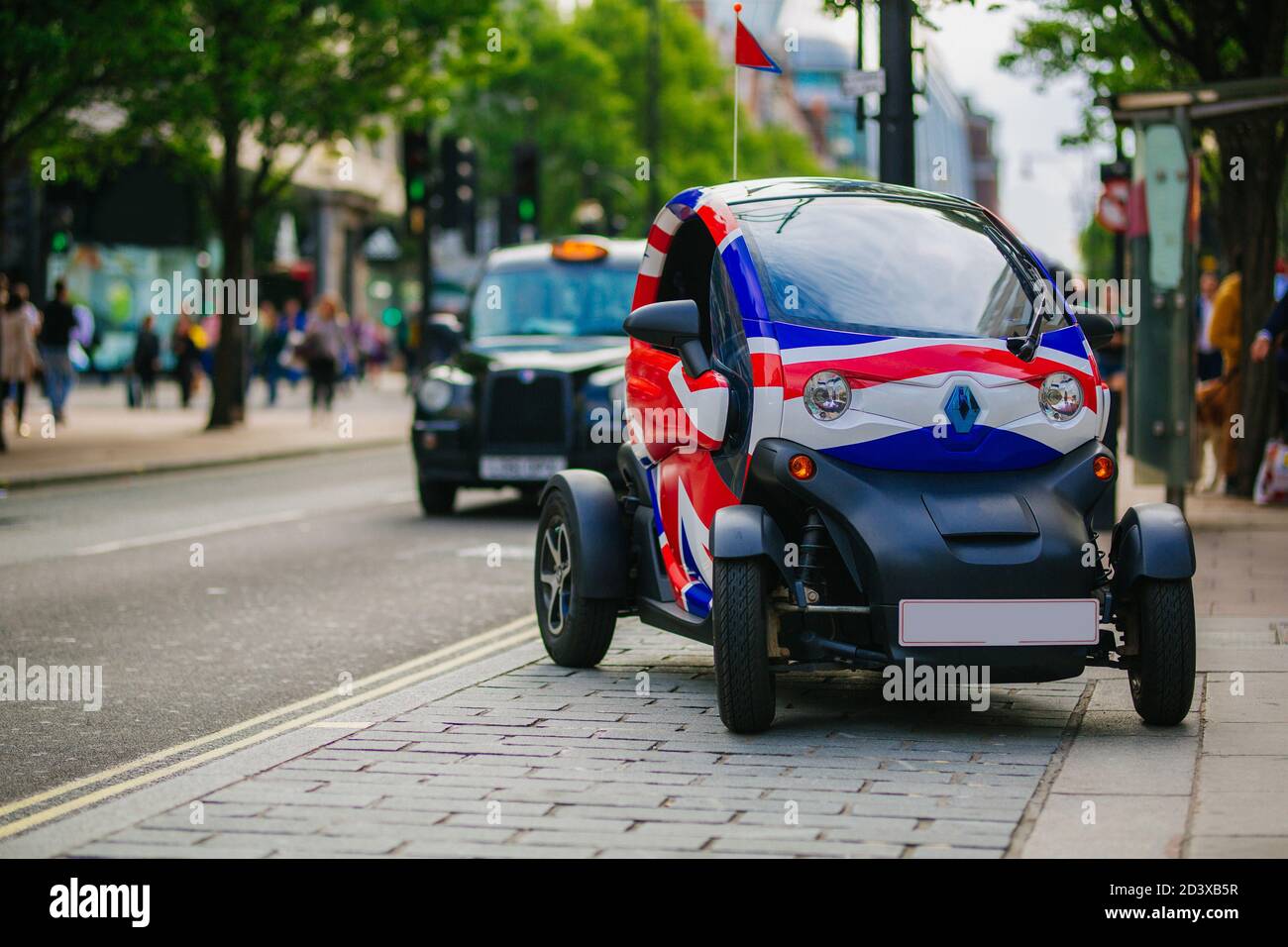 LONDON, UK - MAY 28, 2018:Small modern Renault electric car with union jack flag graphic park in the busy Oxford Street Stock Photo