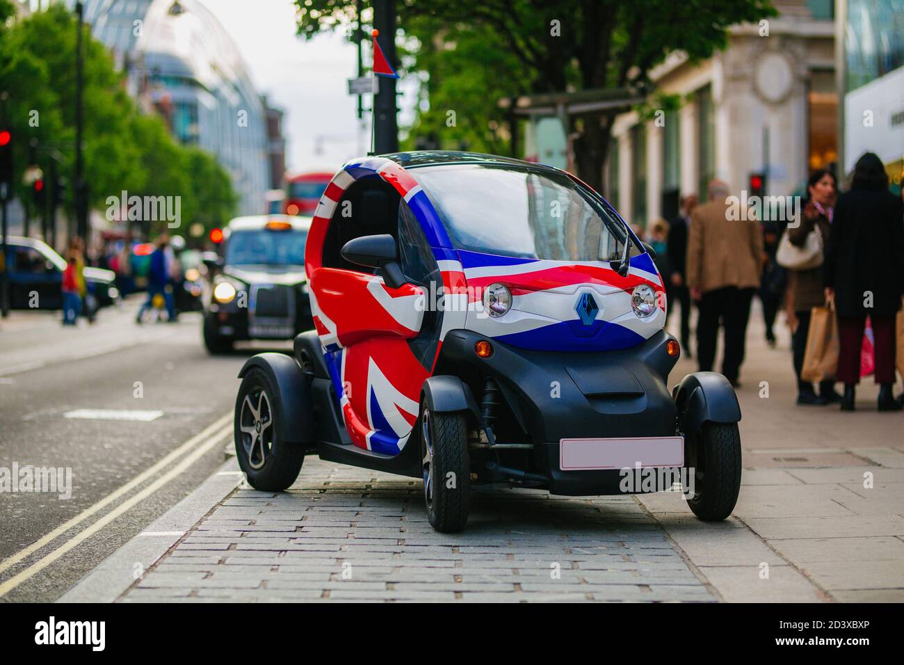 LONDON, UK - MAY 28, 2018:Small modern Renault electric car with union jack flag graphic park in the busy Oxford Street Stock Photo