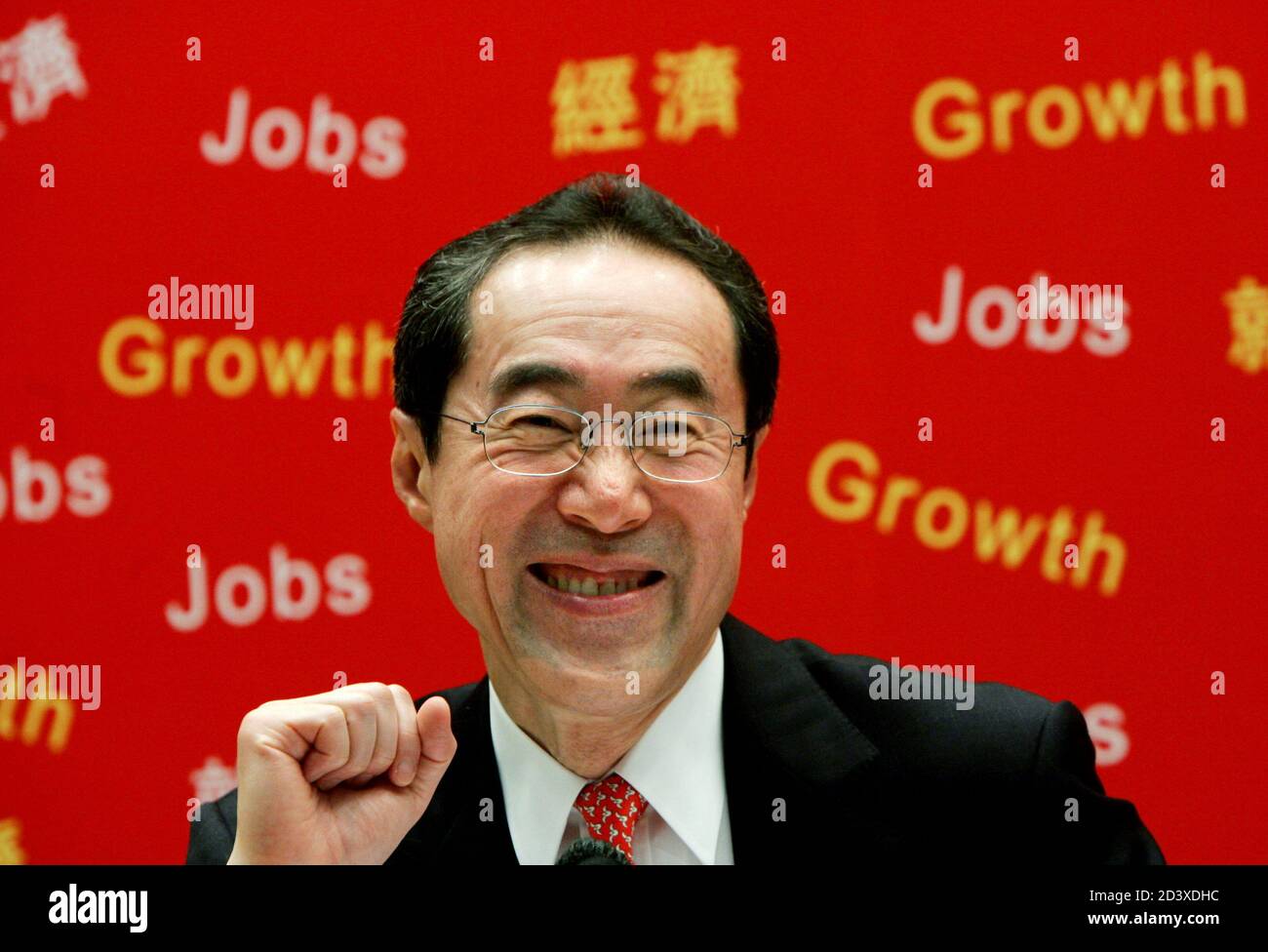 Financial Secretary Henry Tang presents his annual budget at the news conference in Hong Kong March 16, 2005. Tang presented what analysts called a 'responsible' budget on Wednesday, announcing Hong Kong's first fiscal surplus in five years and abolishing estate duty. Stock Photo