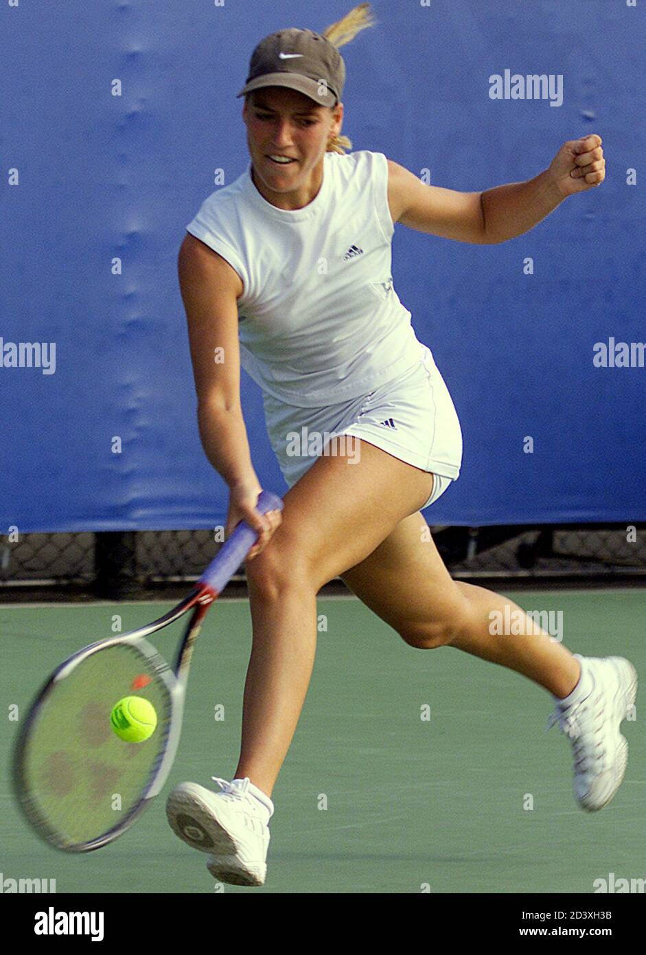 Swiss Federation Cup tennis player Alienor Tricerri's hits a running  forehand during her match against Australia's Nicole Pratt during their  second round Federation Cup tie match at the Sydney International Tennis  centre