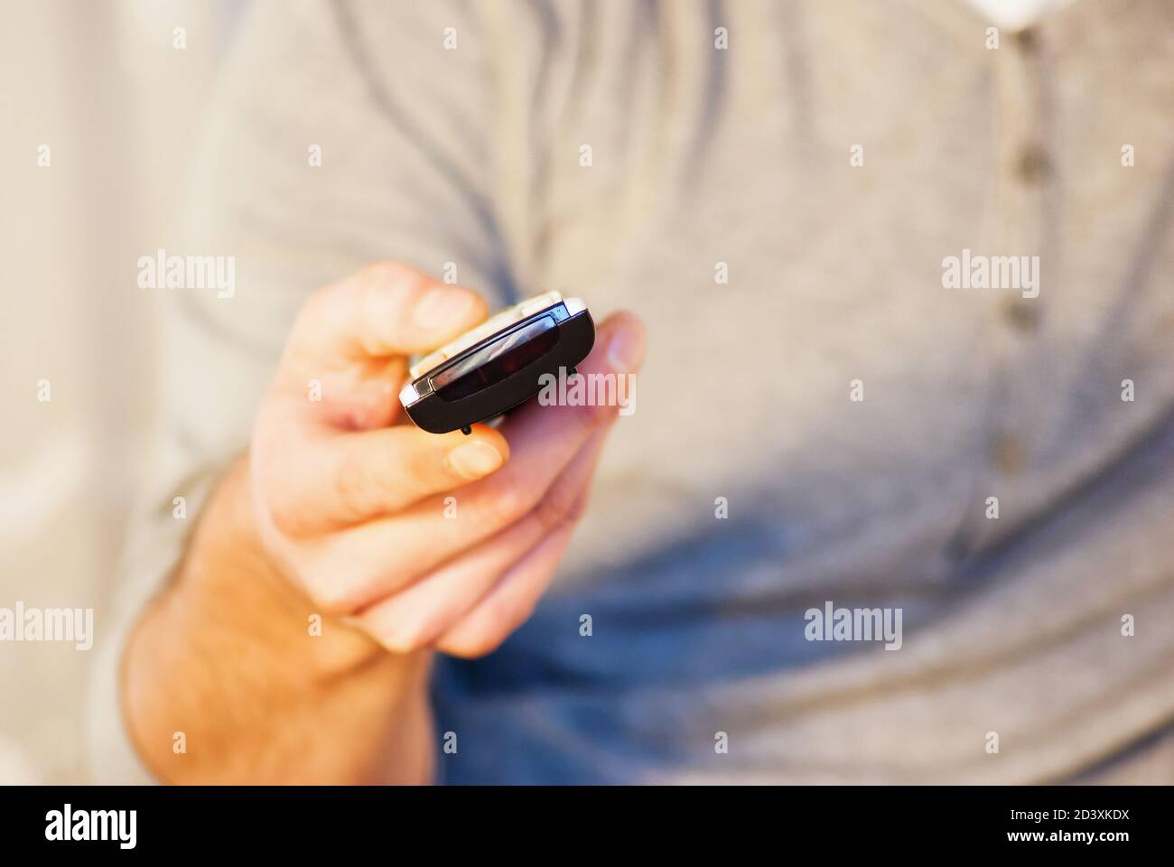 happy mand relaxing using remote controler tech Stock Photo