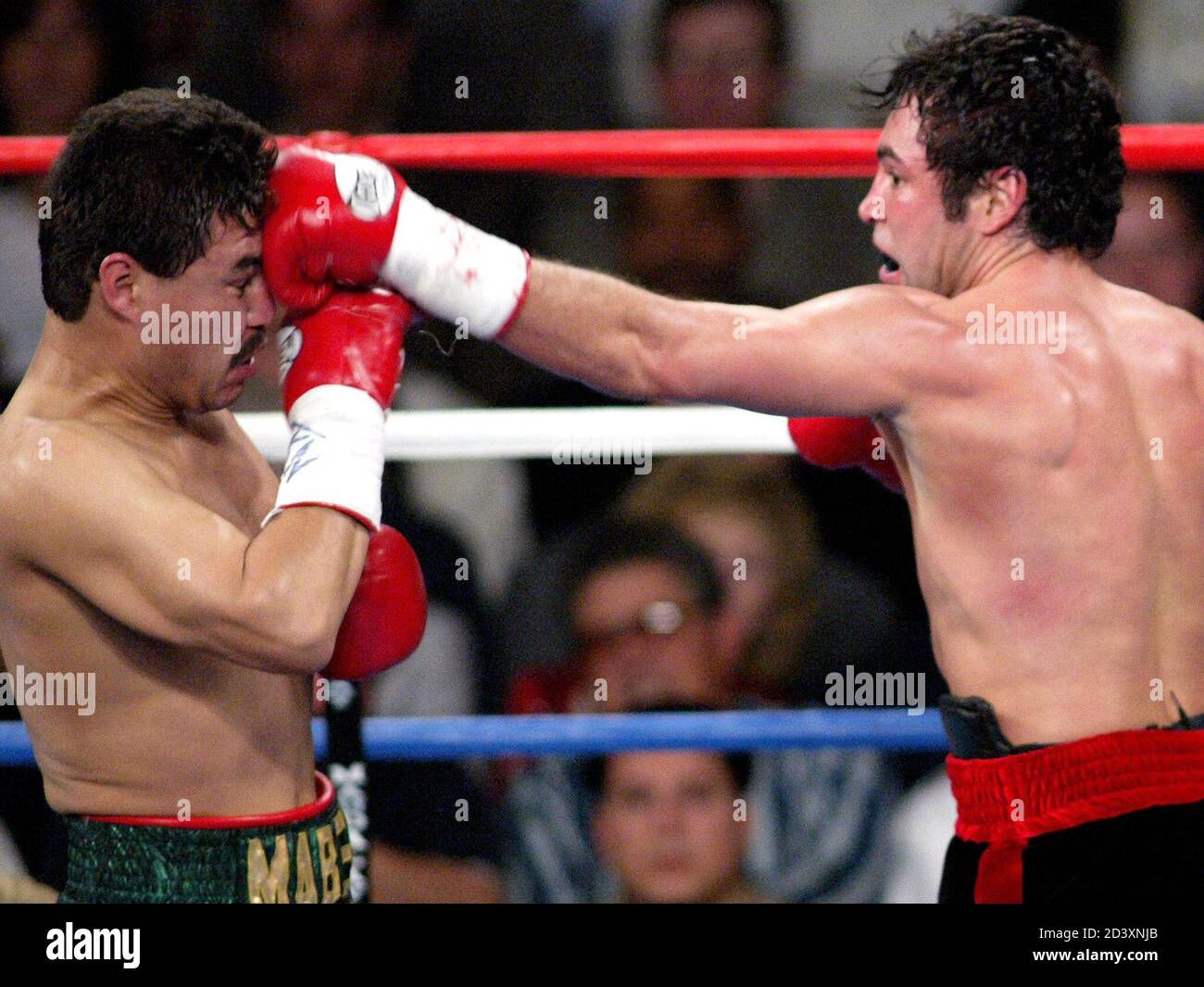 Oscar De La Hoya of Los Angeles, California, (R) connects to the head of Yory Boy Campas of Navojoa, Mexico, in the second round at the Mandalay Bay Events Center in Las Vegas, Nevada, May 3, 2003. De La Hoya retained his WBC/WBA welterweight title when the referee stopped the fight in the seventh round. Picture taken May 3, 2003. REUTERS/Ethan Miller  EM/HB Stock Photo
