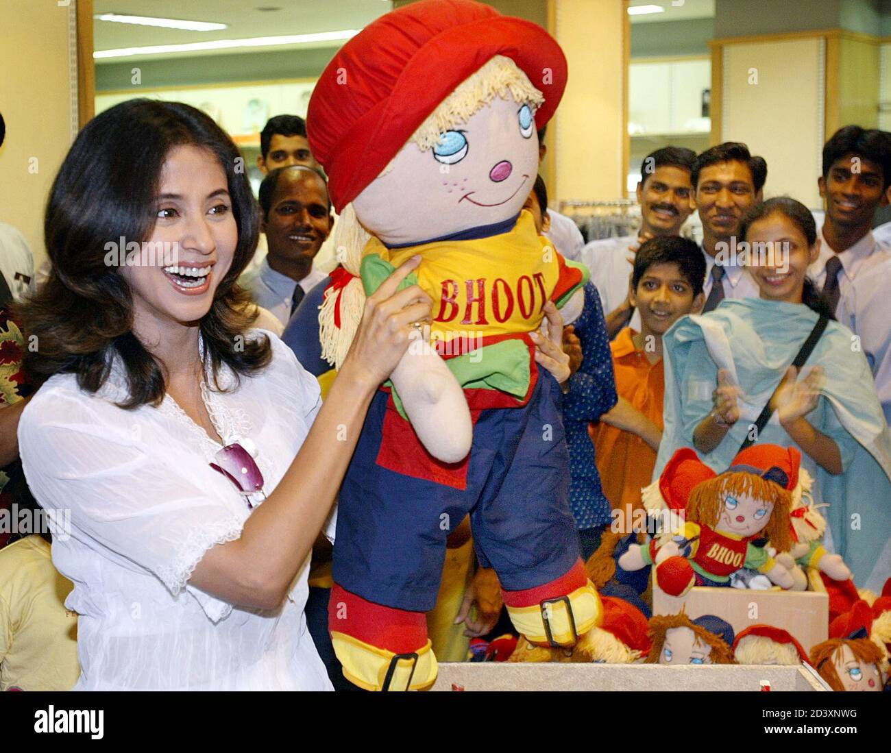 Popular Bollywood actress Urmila Matondkar displays a soft toy after