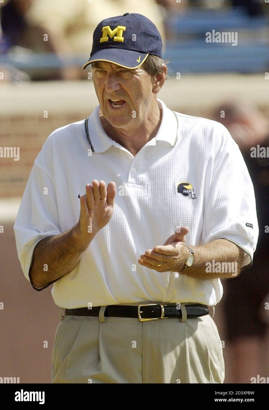 University of Michigan football coach Lloyd Carr yells instructions to his  team August 30, 2003 against Central Michigan, at Michigan Stadium in Ann  Arbor. Michigan's 45-7 win against Central marked Carr's 100th
